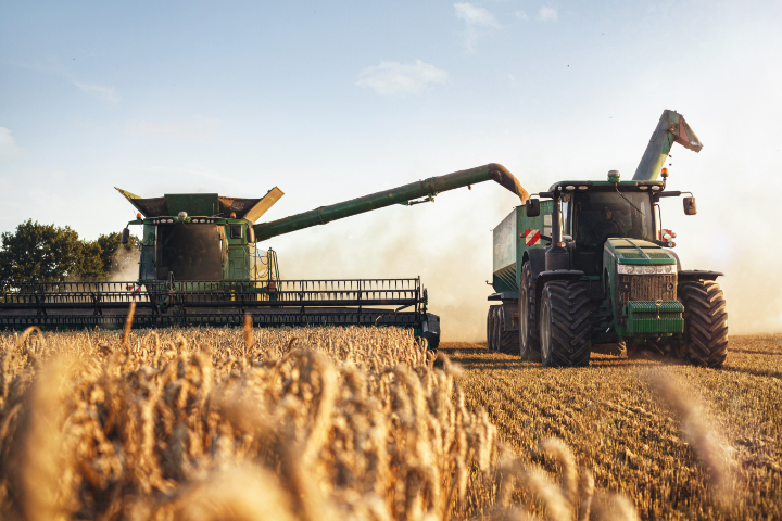 Combine and tractor harvesting