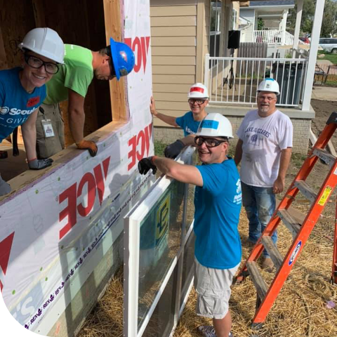 Scoular team working on building house for the community