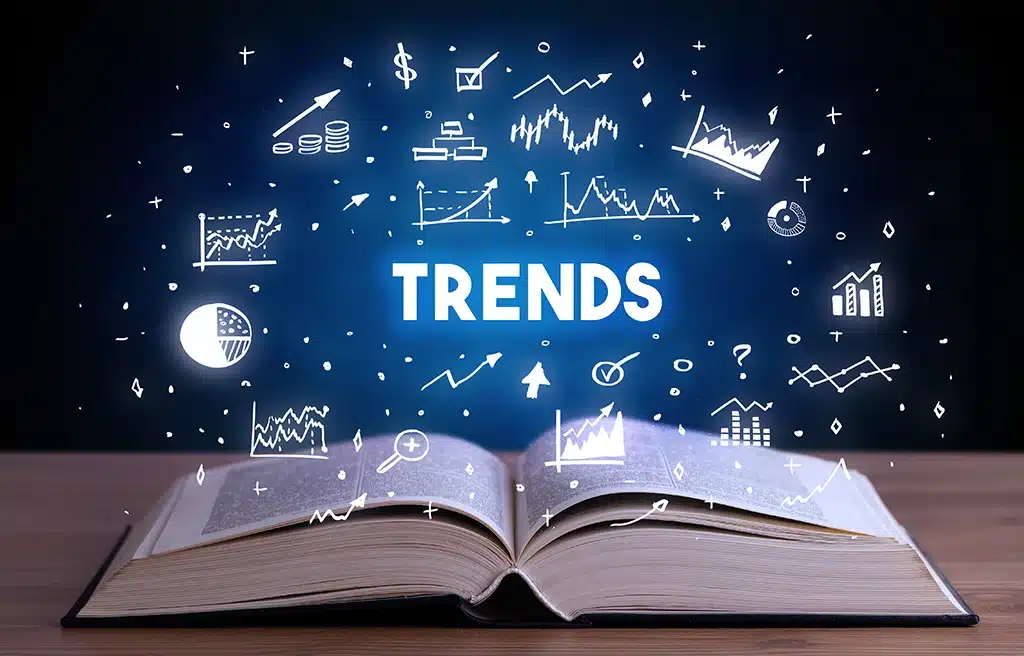 Open book with the word TRENDS glowing above it, illustrating key takeaways from SupplySide Global 2025.
